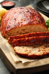 Delicious baked turkey meatloaf on table, closeup