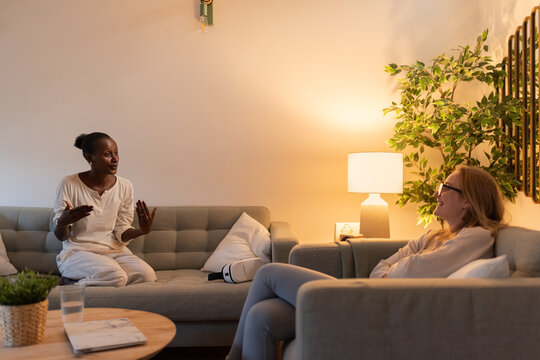 Women talking in living room