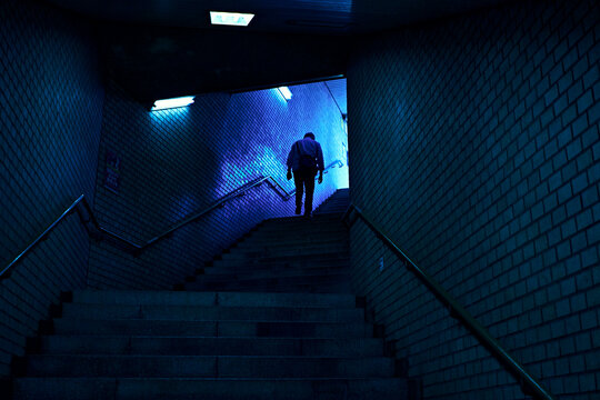 Fototapeta A man walks into the street.