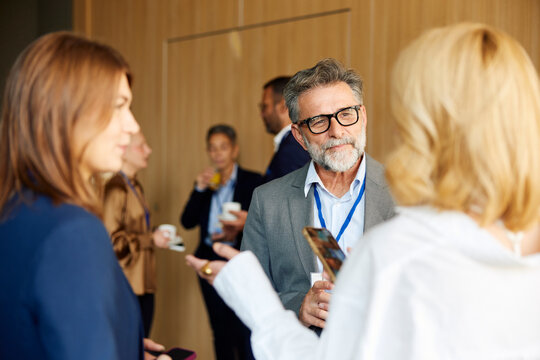 Colleagues chat at the conference