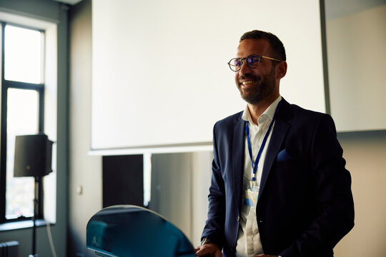 Businessman at a conference, smiling