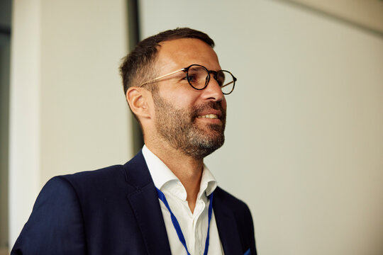 Smiling businessman at a conference