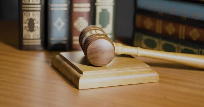 A gavel on a table symbolizes authority, wisdom, and justice