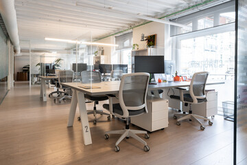 Coworking open space office with plexiglass dividers