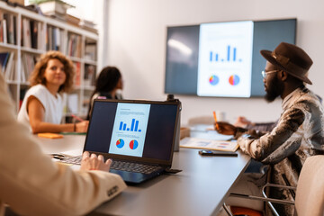 Business people working together in modern office using laptop