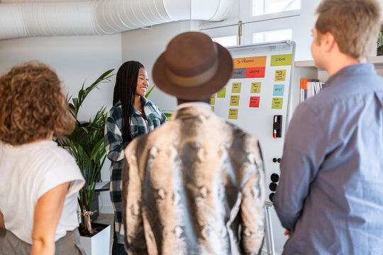 Creative people working on a project using kanban methodology