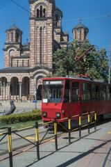 Naklejka premium St. Mark's Church or the Church of St. Mark and tram in old historical city center of Belgrade, Serbia at daytime