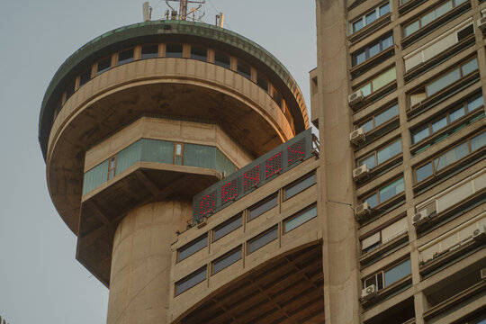 Brutalism socialist architecture buildings of Genex Tower or Western City Gate in New Belgrade Block district at sunset