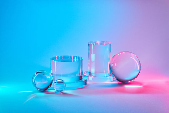 Crystal-clear geometric objects in illuminated studio
