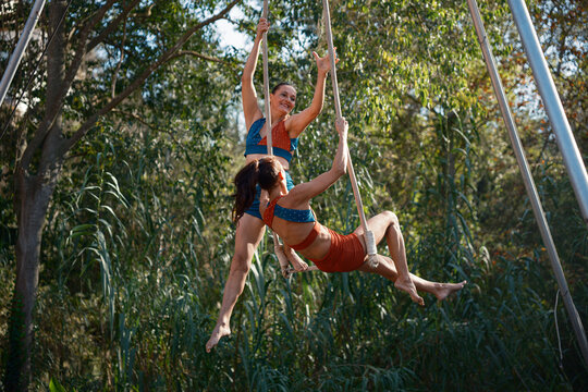 Trapeze duo performing outdoors