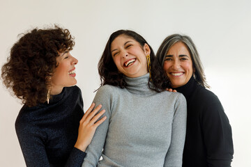 Three women in a joyful moment together