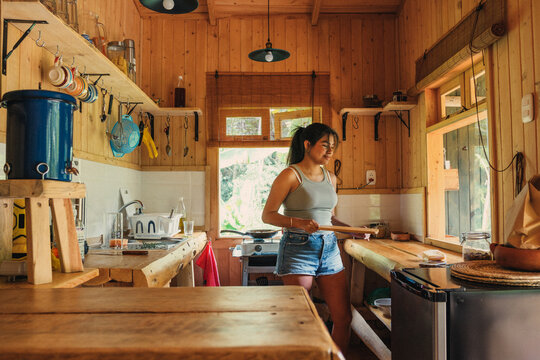 Woman cooking food at home kitchen