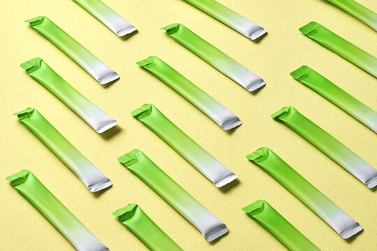 Pattern of Green and White Snack Bars on Yellow Background