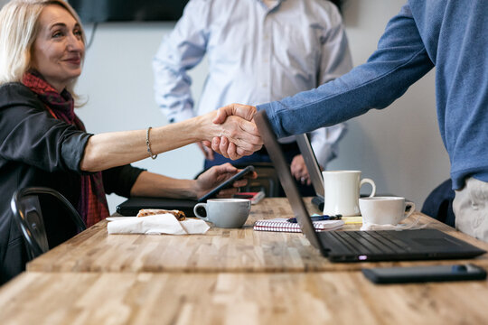 Business: Team Members Shake Hands To Agree On Design