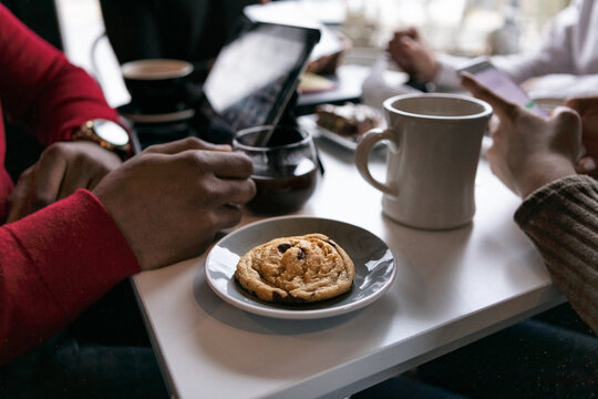 Business: Focus On Cookie On Table During Meeting