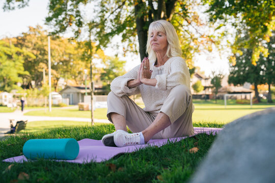Happy, Healthy Senior Woman Meditating Outdoors in a Vancouver Park