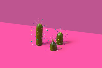 Festive arrangement of cucumbers decorated with sewing pins in studio