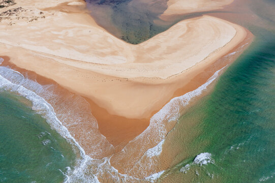 Waves lapping onto coastal sand bar
