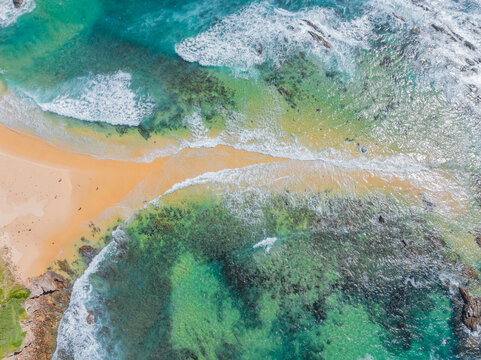 Waves breaking over a narrow beach