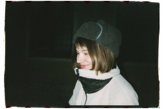 Happy woman with warm clothes smille and walk by the street 