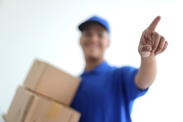 Deliveryman in Blue Uniform Ringing a Doorbell With Boxes in Hands