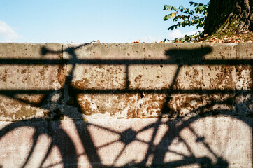Vintage Bicycle Shadow on Old Concrete Wall