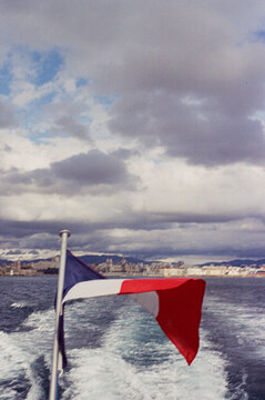 Vintage vibe with French Flag waving in speedboat