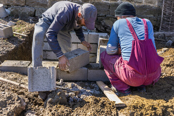 Block masons fit cinder blocks.
