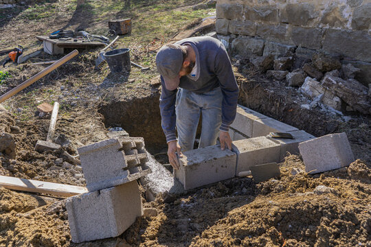 Block mason fits cinder blocks.