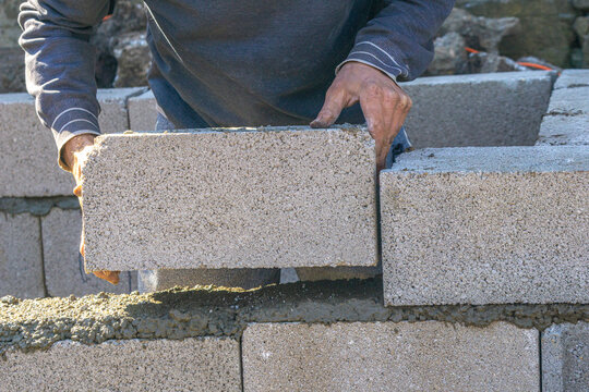 Block mason fits cinder blocks.