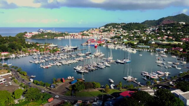 Establishing marina aerial of yachts and boats in Saint George Grenada Harbor