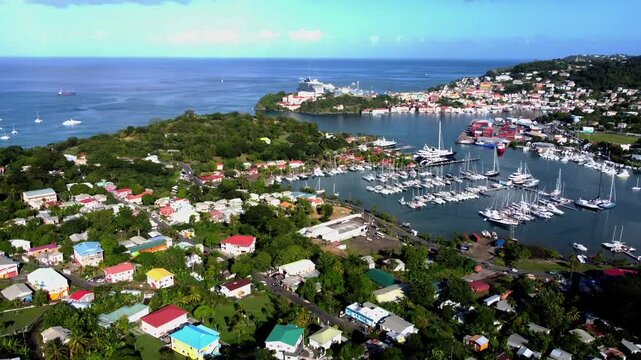 Establishing aerial shot of sunny St George houses, boats and cruise ship port