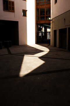 Conceptual shadowplay image: shadow and light creating arrow shape