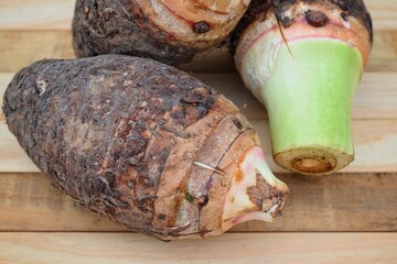 Fresh taro raw on wood background
