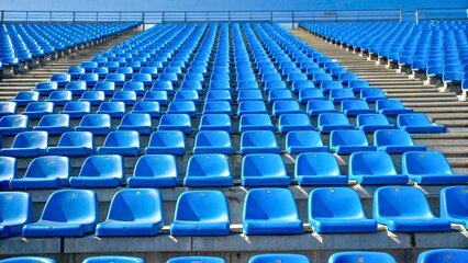 Blue Stadium Seats in a Row Under Clear Sky on a Bright Day