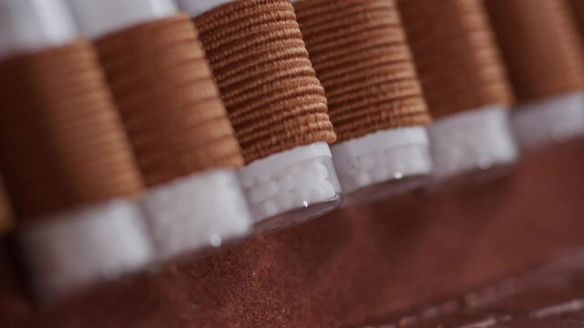 Close up homeopathic globoli glass.