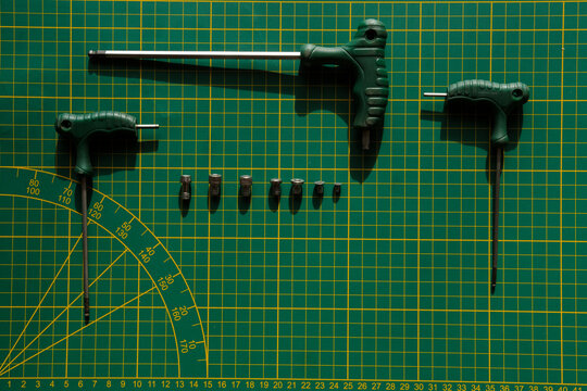 Tools on table with green desk.