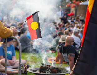Australian aboriginal flag at the indigenous Smoking Ceremony, meeting and rite at public event