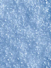 Background of winter snow texture. Small ice crystals on surface of snow natural background