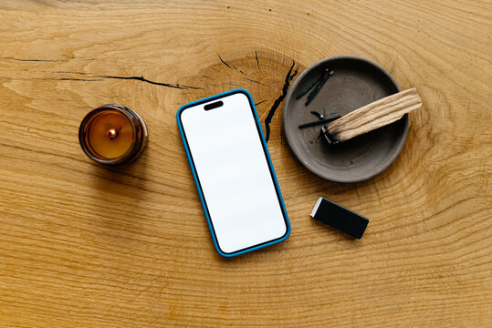 A mobile phone with white screen on the table