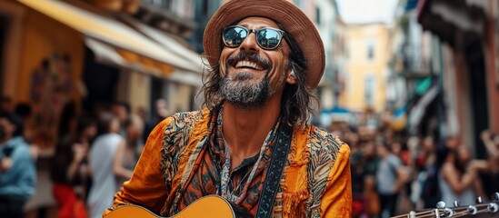 Obraz premium Vibrant street musician joyfully performing with guitar in a bustling urban market filled with people