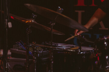 Drummer playing drums during a live jazz performance.