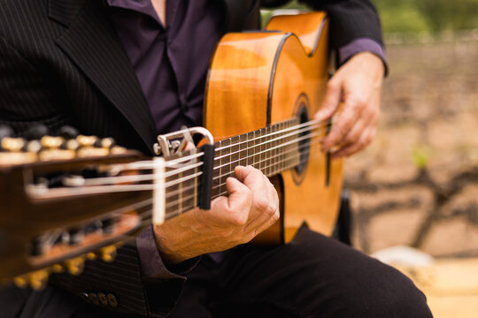 A guitarist, plays the acoustic classical guitar, during a wedding party in Spain