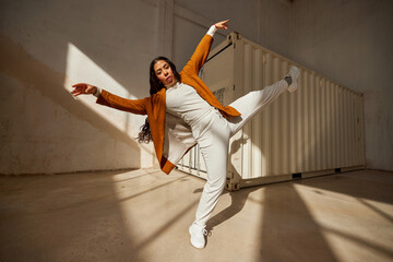 Cheerful diverse women dancing in street