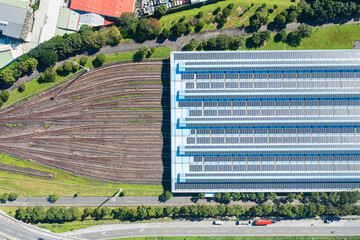 Railway depot yard with adjacent solar panels