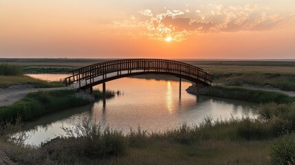 Fototapeta premium Tranquil Sunset Over a Silhouetted Bridge