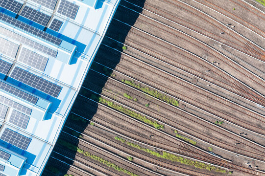 Aerial View of Metro Depot with Solar Panels and Railway Tracks