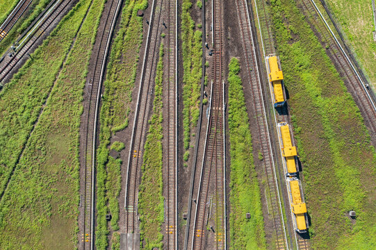 Aerial View of Multiple Railway Tracks with Yellow Trains