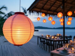 Fototapeta premium Cozy Outdoor Dining Setting with Lanterns at Sunset by the Water