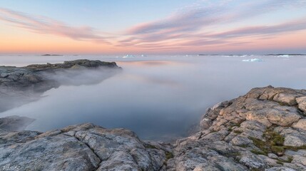 Fototapeta premium Misty Fog Rolling Over Rocky Peninsula at Sunset